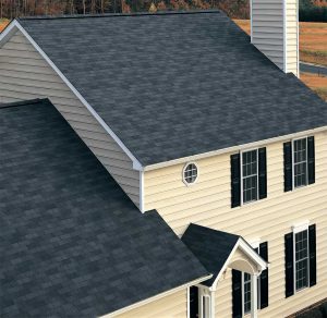 A large home with a new dark shingle roof